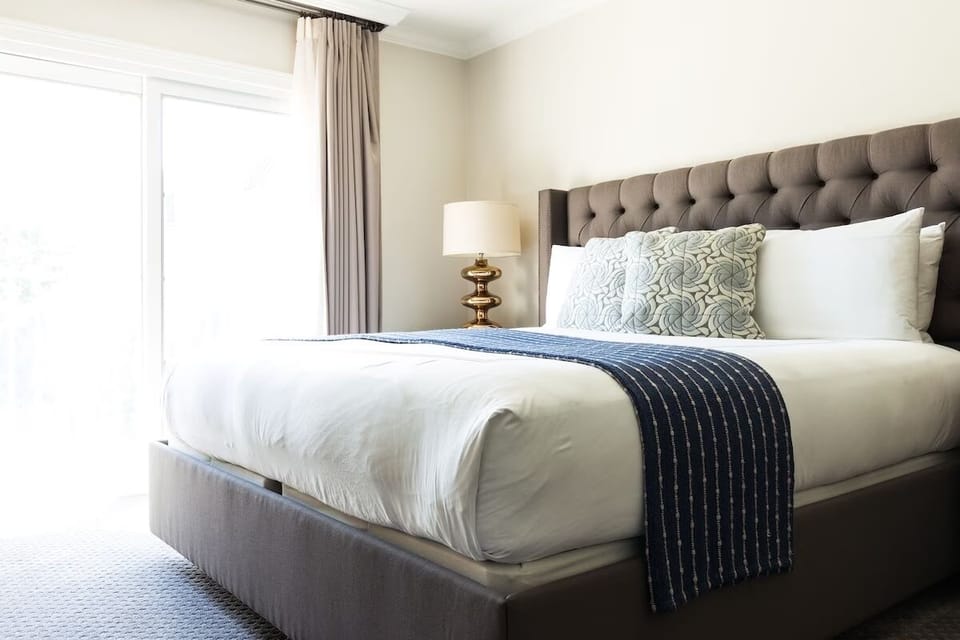 Sink into crisp linens for a restorative night’s sleep.