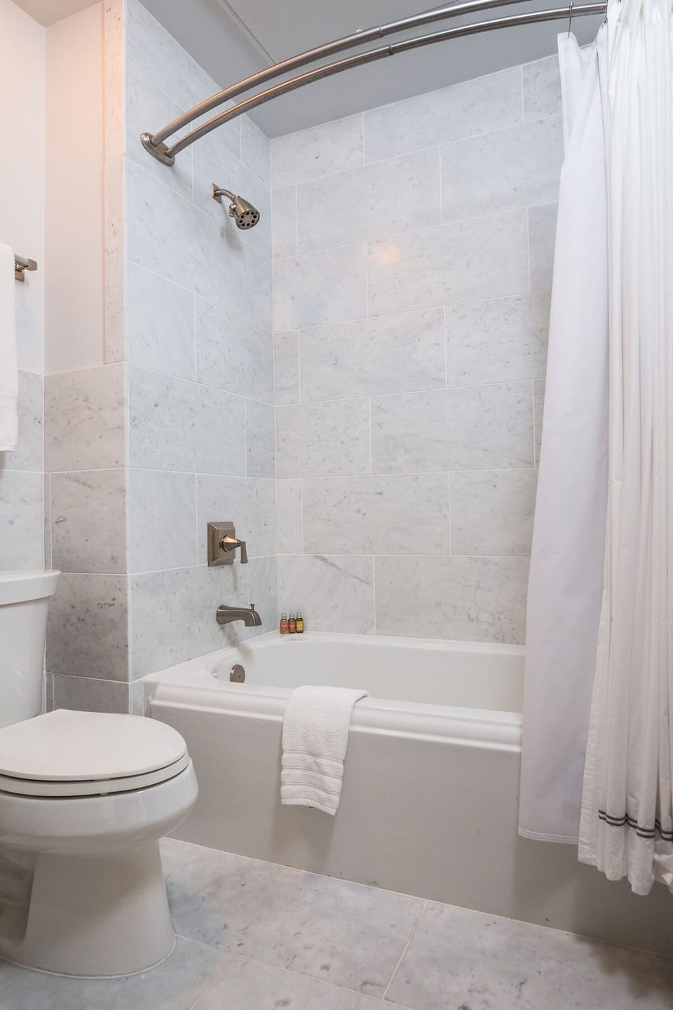 Unwind with a hot soak in the spotless tiled tub.