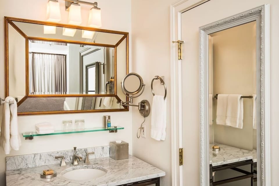 Refresh effortlessly at the marble vanity with bright, flattering light.