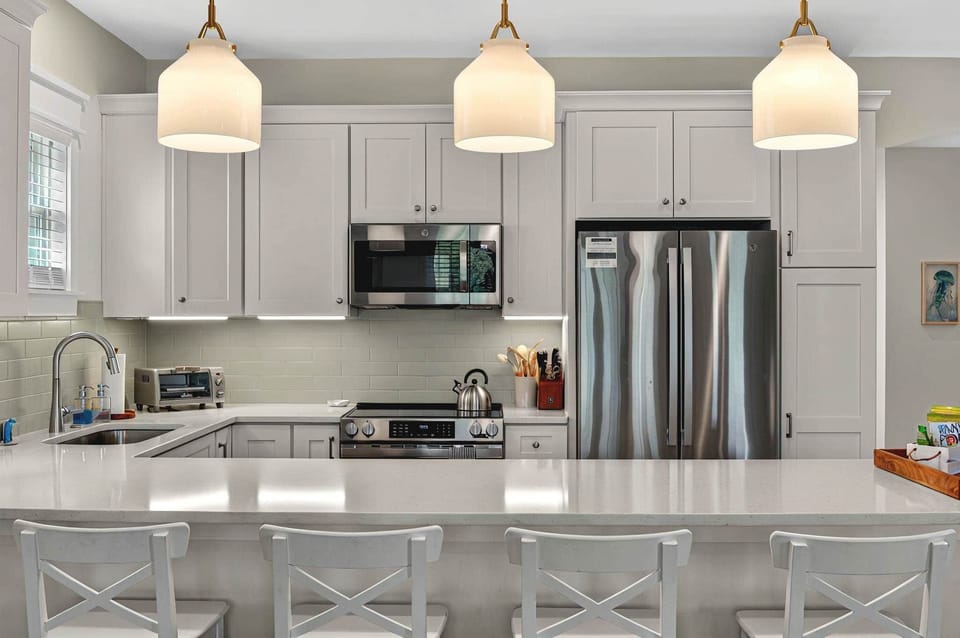 Fully equipped kitchen with modern appliances and generous counter space.