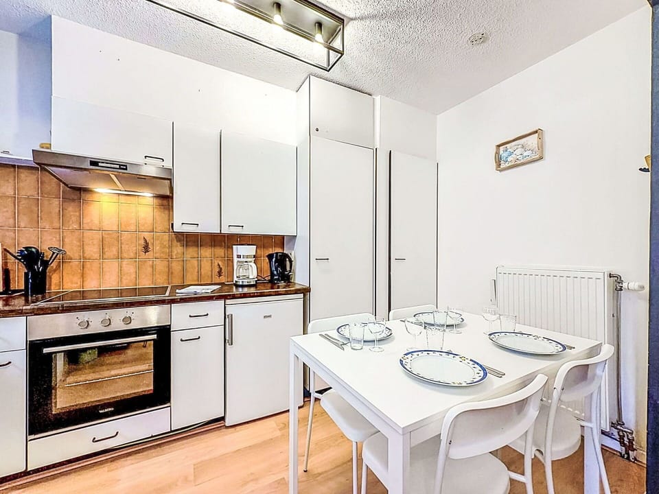 Interior Design, Flooring, Floor, Ceiling, Room, Furniture, Apartment, Kitchen, Major Appliance, Kitchen Appliance