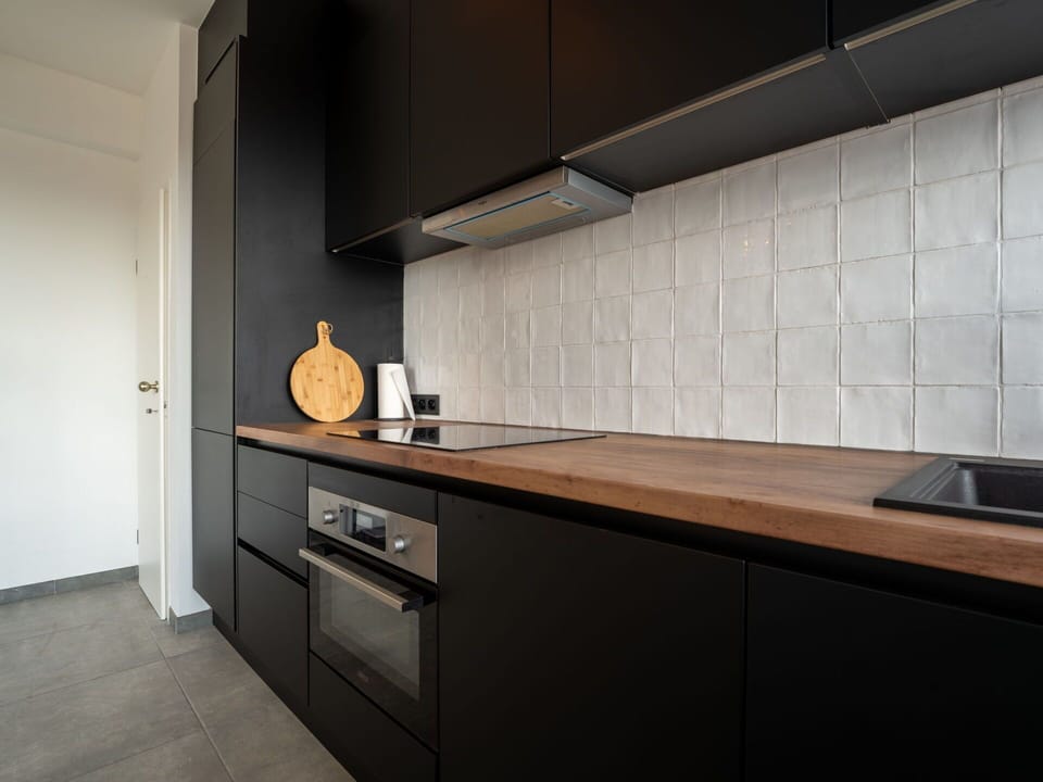 Flooring, Countertop, Wood, Interior Design, Kitchen, Cabinetry, Floor, Kitchen Appliance, Home, Room