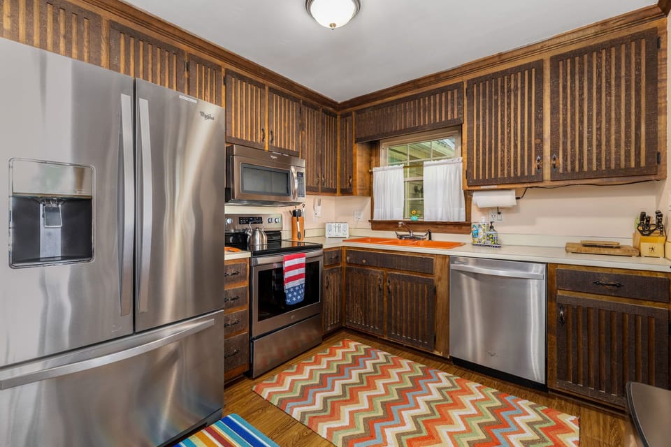 Full sized refrigerator with ice maker.  