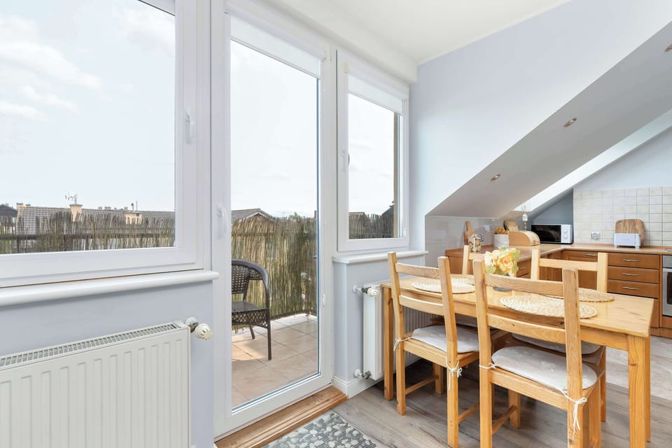 Calm colors and a touch of greenery create a soothing interior vibe.