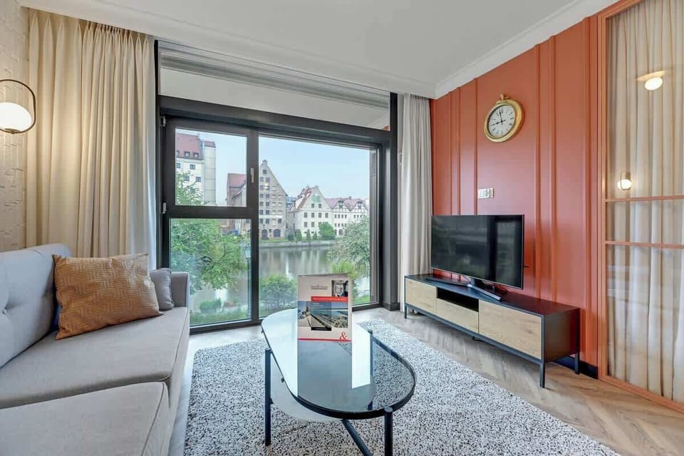 Vibrant and polished interior fuses contemporary elegance with warm, captivating accents, exuding an inviting yet sophisticated ambiance.