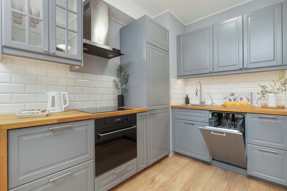 A closer look at the kitchen corner with an integrated oven and stove.