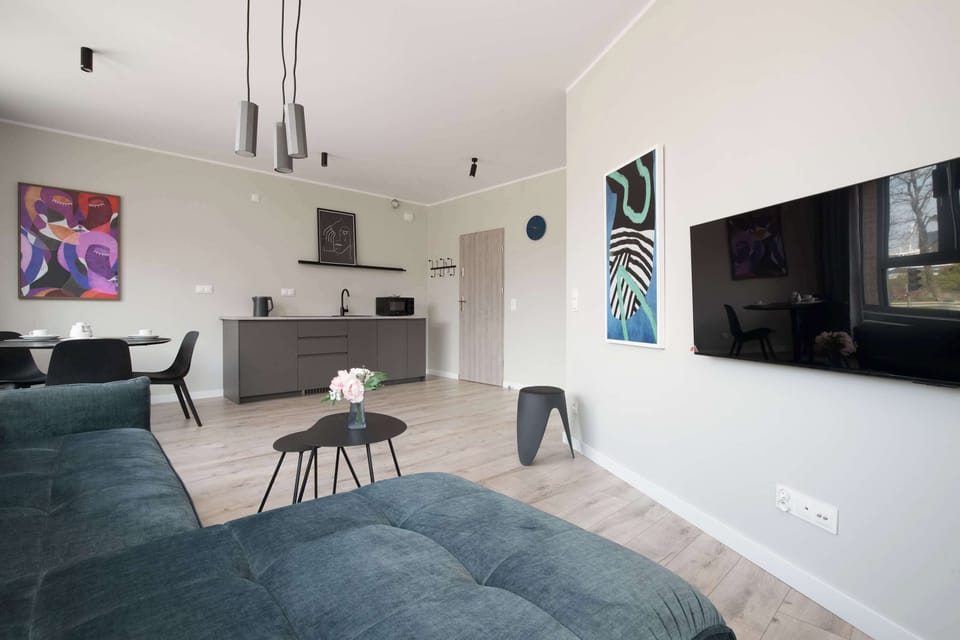 The elegant living room featuring a sofa, perfect for relaxing or sleeping.