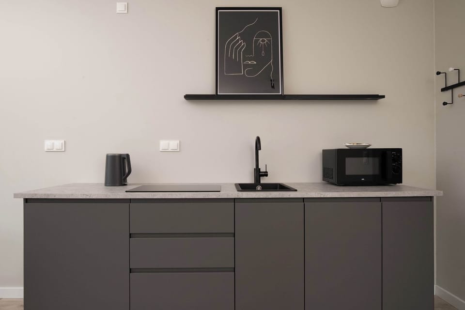 The fully equipped kitchenette includes everything you need for a home-cooked meal.