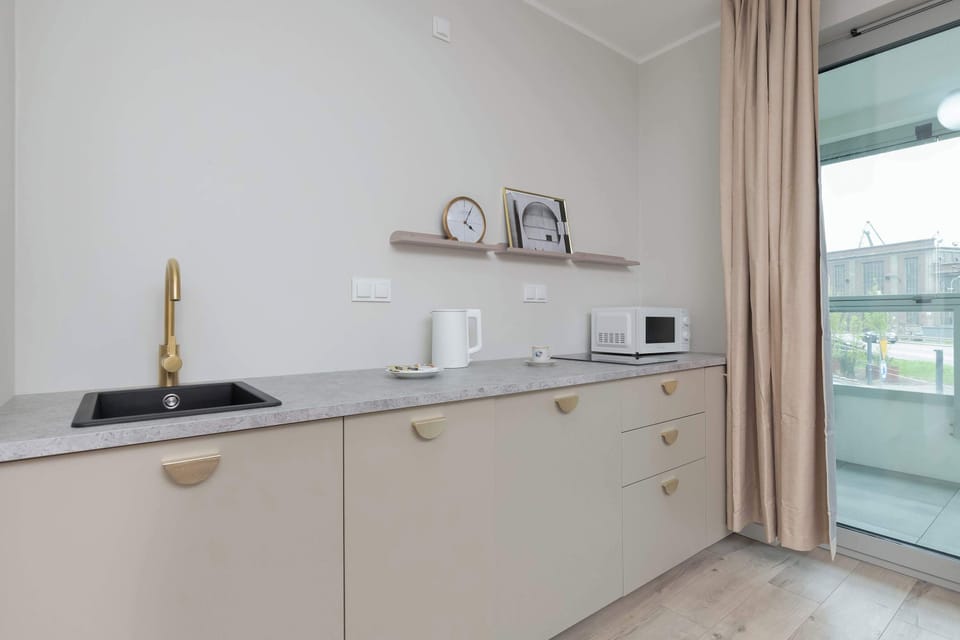 The fully equipped kitchenette includes everything you need for a home-cooked meal.