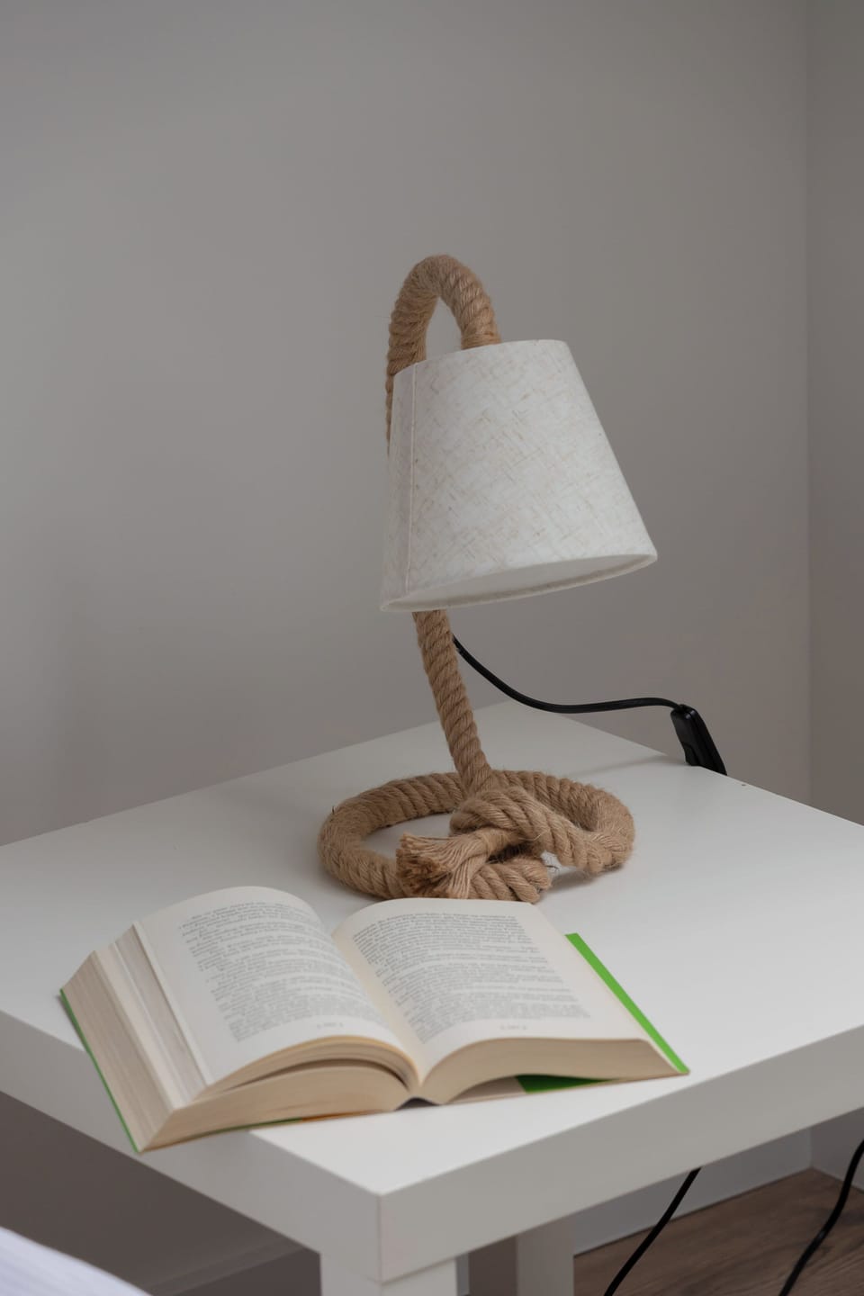 A close-up of a decorative bedside lamp, adding a warm, stylish touch to the room.