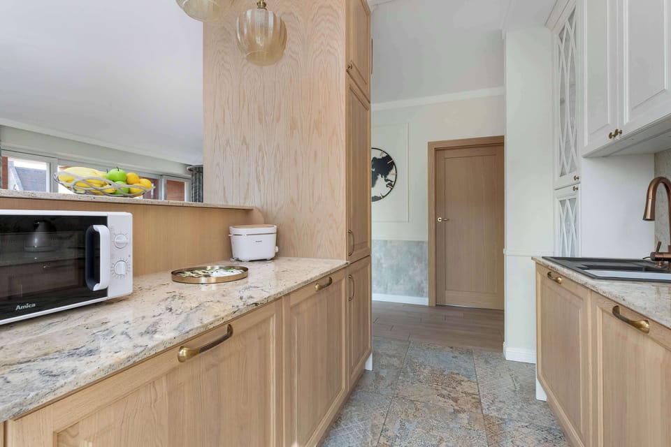  Another perspective of the kitchenette showing the dining space and the seamless transition to the living room.