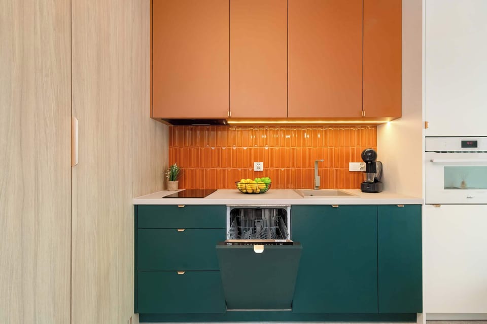 Bright kitchenette with cooking utensils. 