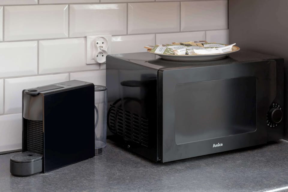 Kitchen with oven and refrigerator. 