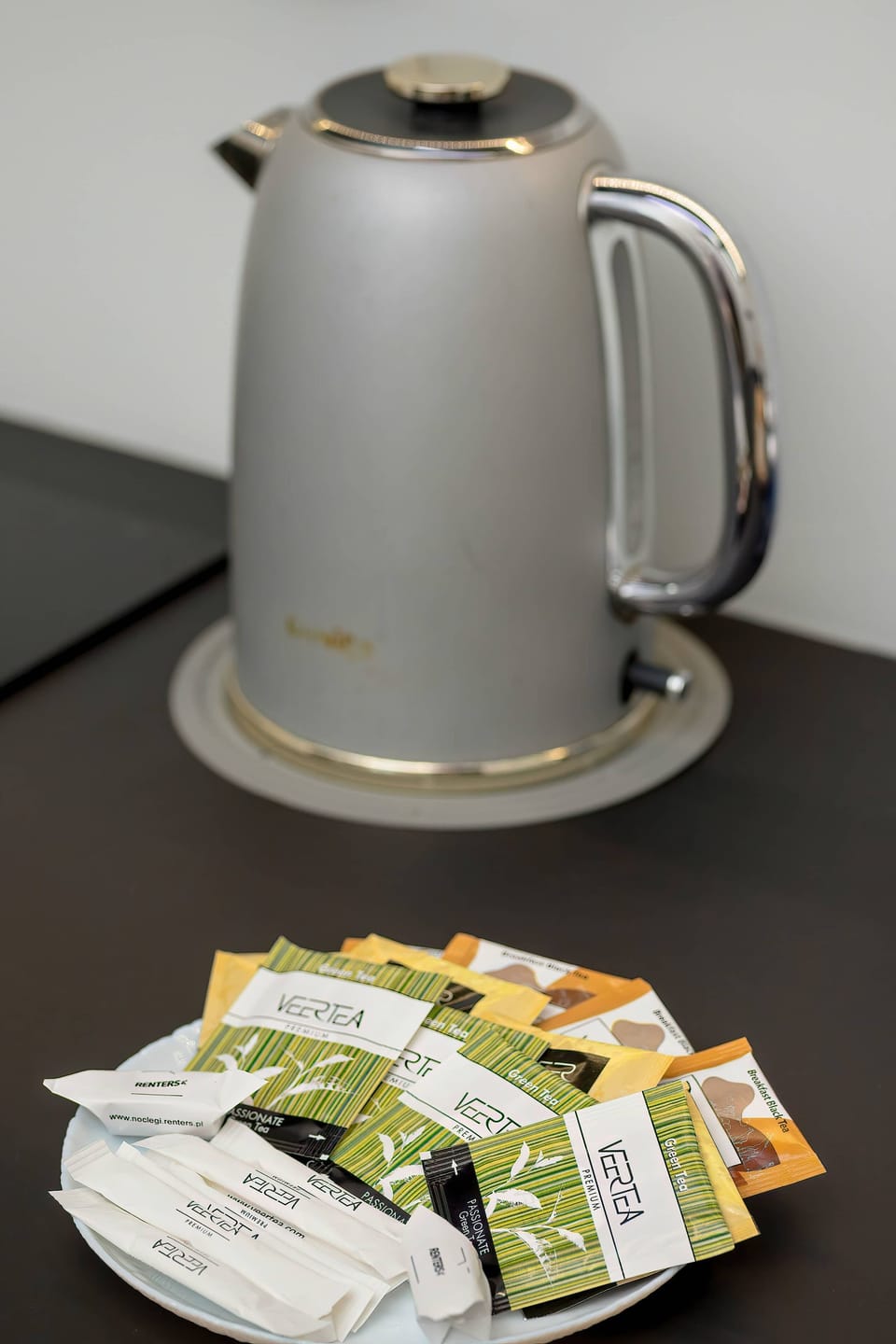 Close-up of electric kettle and tea set.