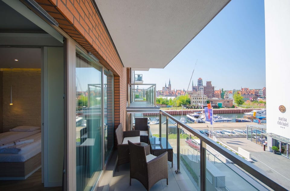 A balcony with a stunning view of the surrounding area, ideal for enjoying fresh air.