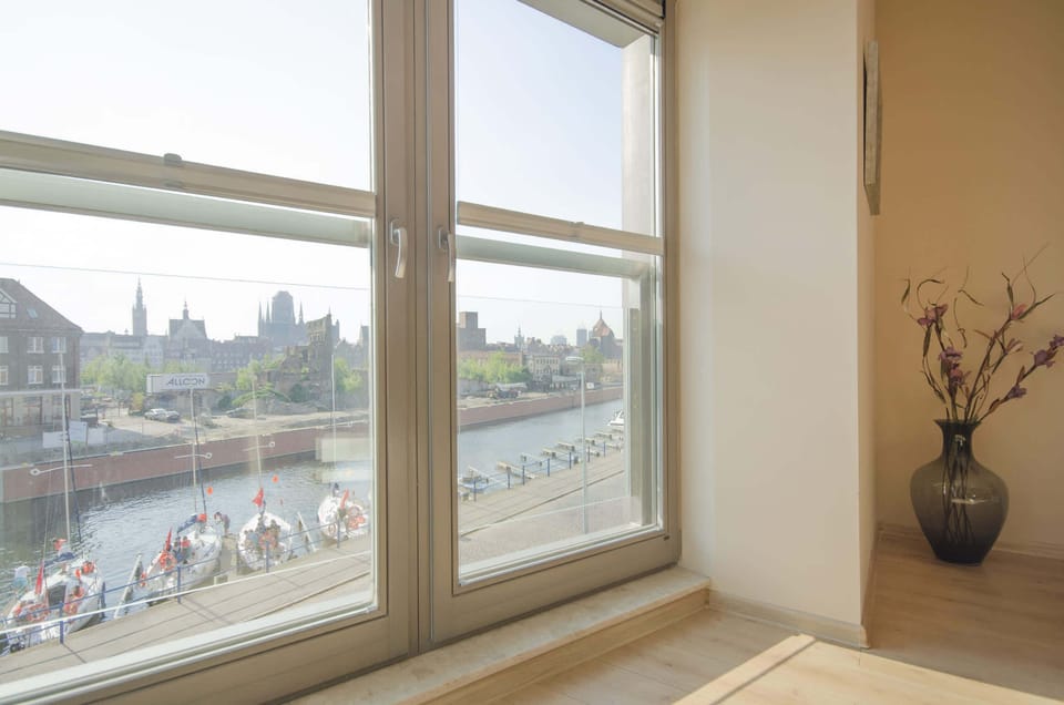 View from the window of the river and standing boats.