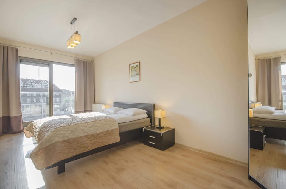 A bright, cosy bedroom with a double bed.