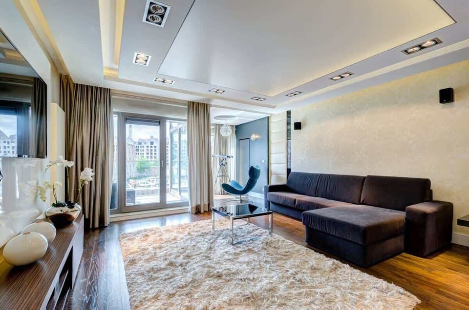 Elegant living space with designer accent wall and ambient lighting.