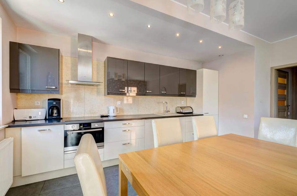 Fully equipped kitchenette with dining area.