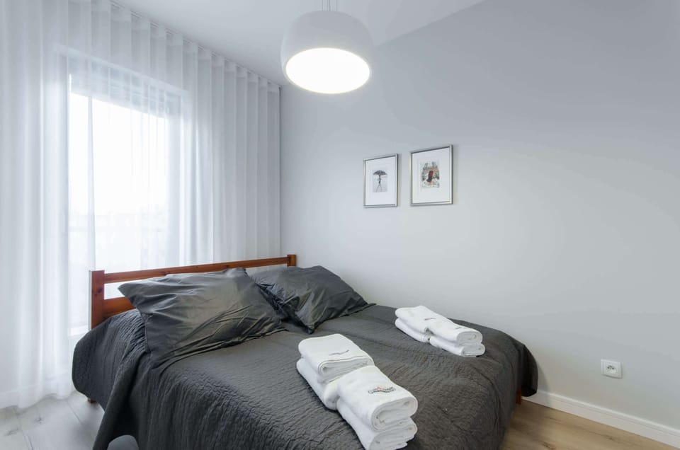 Cozy bedroom with a comfortable double bed.
