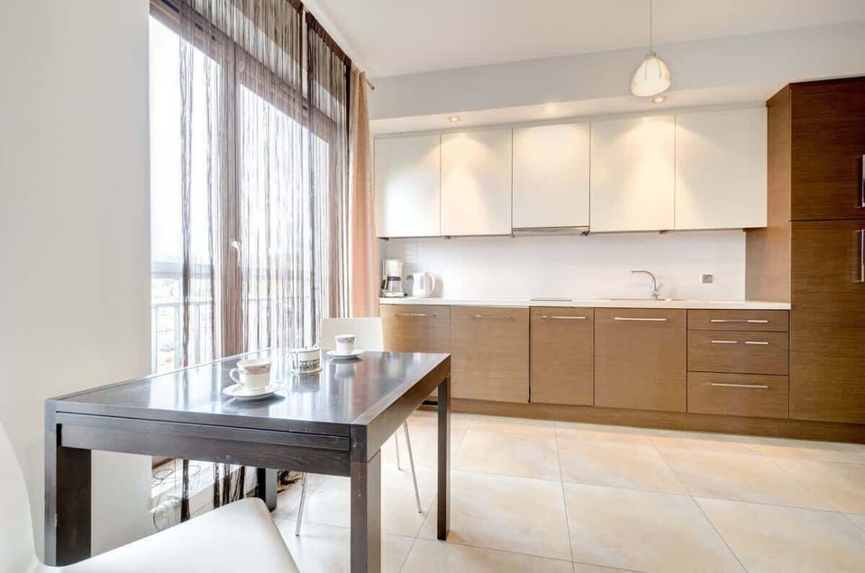 The kitchen comes with essential appliances, like a fridge and coffee maker. A convenient place for cooking and dining.