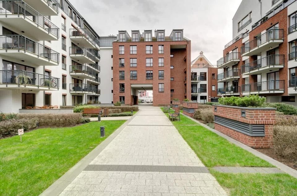 The green patio at this apartment  is a peaceful oasis in the heart of the city, offering a relaxing space for residents and guests. 