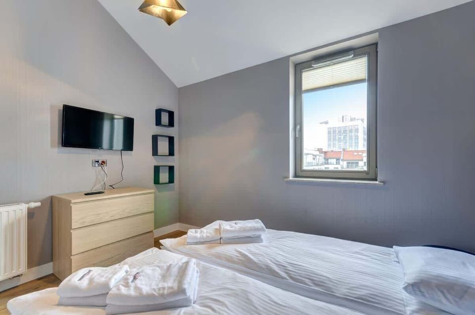 The space feels bright and spacious thanks to a large window that lets in plenty of natural light.