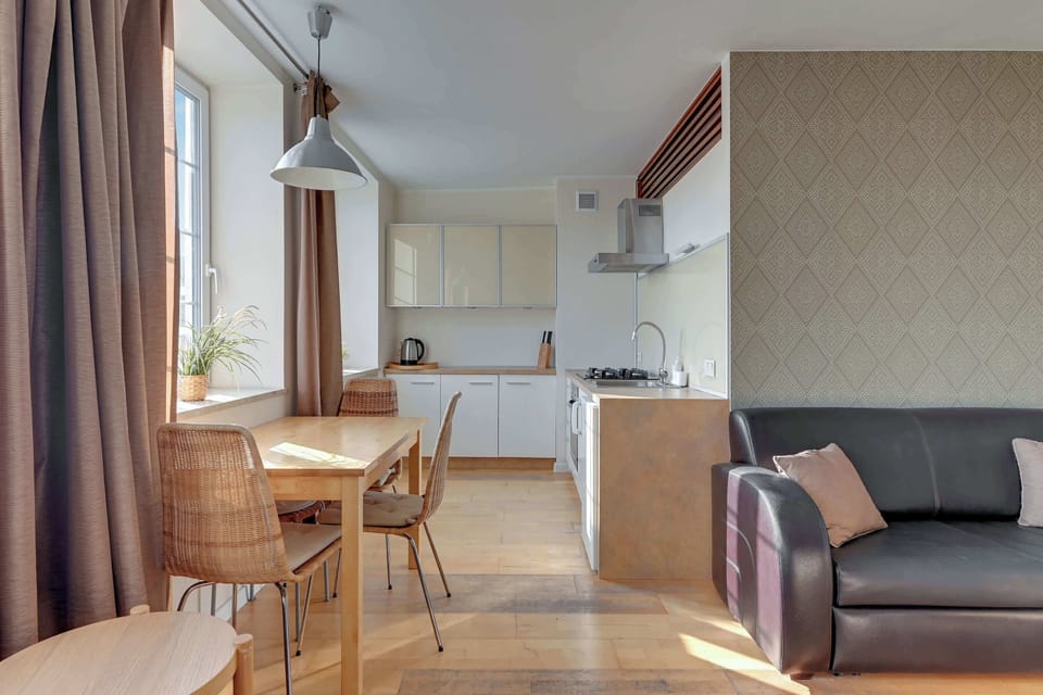 The elegant living area featuring a double sofa bed, perfect for relaxing or sleeping.