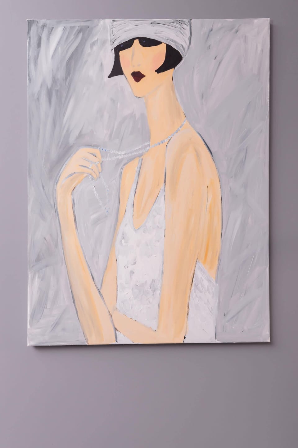 A close-up of a framed art print of a woman, contributing to the artistic ambiance of the apartment.