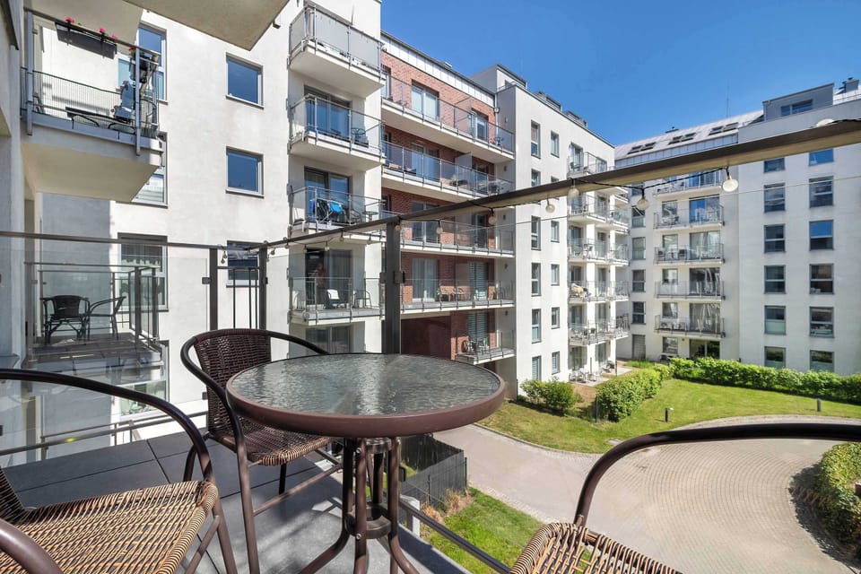 Balcony with garden furniture.