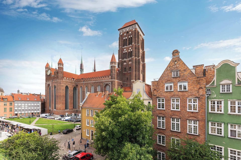 The apartment has a beautiful view of St. Mary's Basilica in Gdansk.