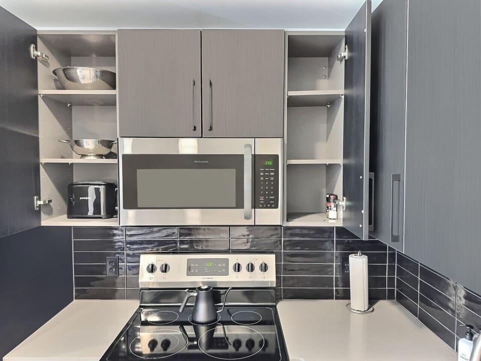 Organized kitchen space with all the essentials you need, perfect for a short-term rental.