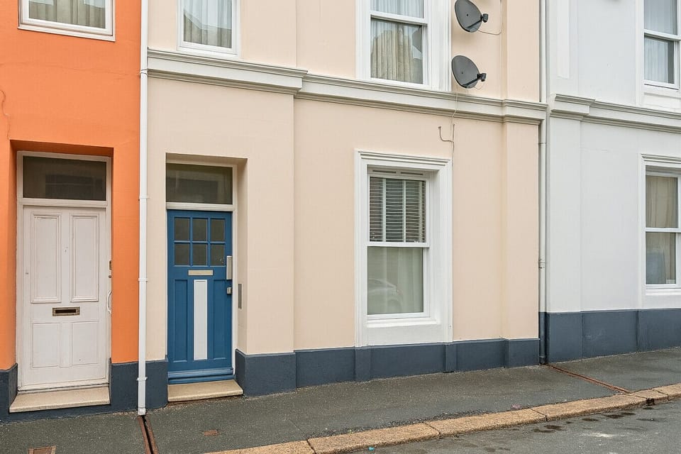 The colourful front door welcomes you home