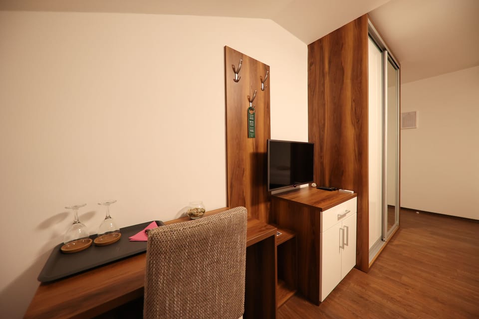 Superior Triple Room, Balcony, Sea View | Minibar, in-room safe, desk, blackout drapes
