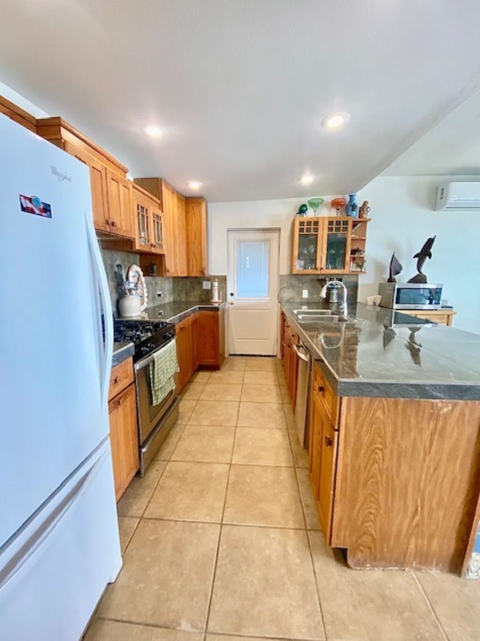 Fully Equipped kitchen. Opens to dining room & living room