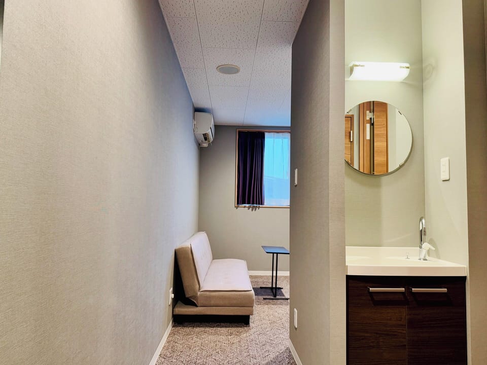 Economy Triple Room | Blackout drapes, iron/ironing board, free WiFi