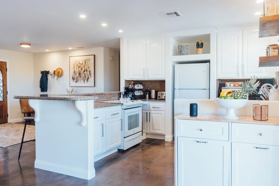 Bright kitchen with island and ample space for cooking and gathering.