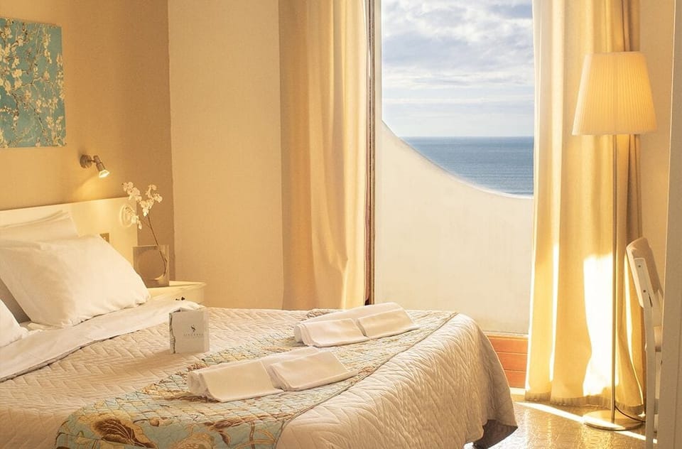 Tripla Comfort Vista Mare con Balcone | 1 bedroom, minibar, in-room safe, desk
