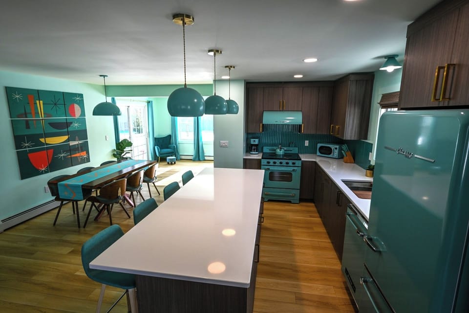 Modern island with bar seating and stylish pendant lighting.