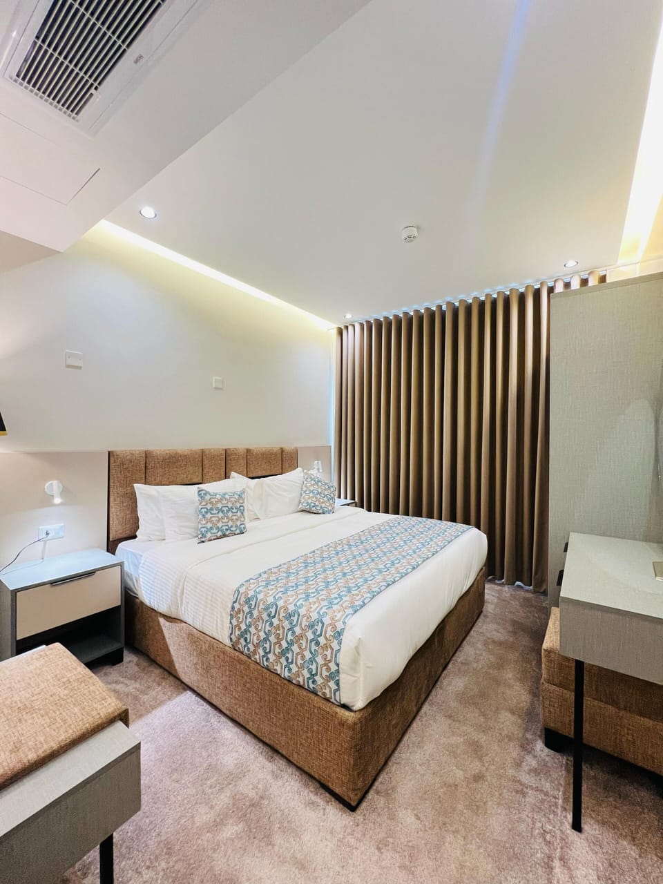 Luxury Suite, Courtyard View | In-room safe, desk, laptop workspace, blackout drapes