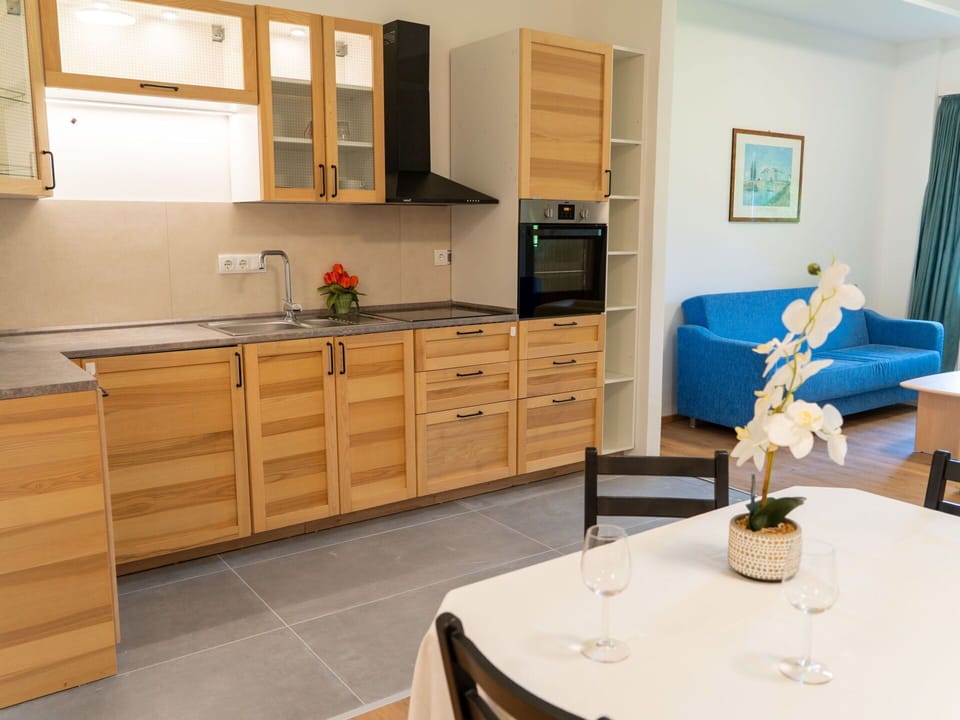 Furniture, Flooring, Cabinetry, Wood, Interior Design, Kitchen, Floor, Countertop, Room, Cupboard