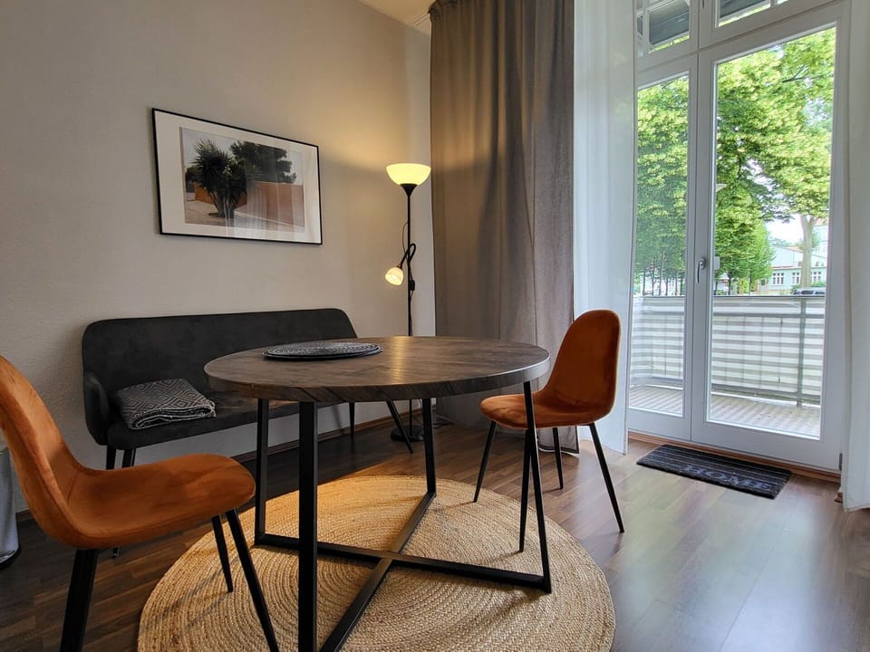 Furniture, Interior Design, Flooring, Floor, Wood, Chair, Table, Room, Wood Flooring, Lighting