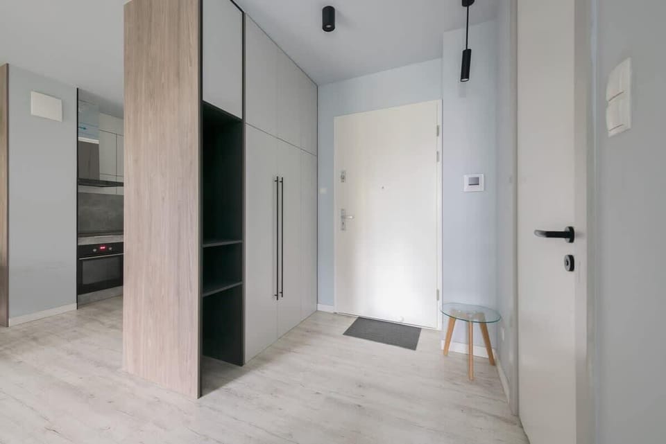 A bright and welcoming hallway with clean lines and practical storage.
