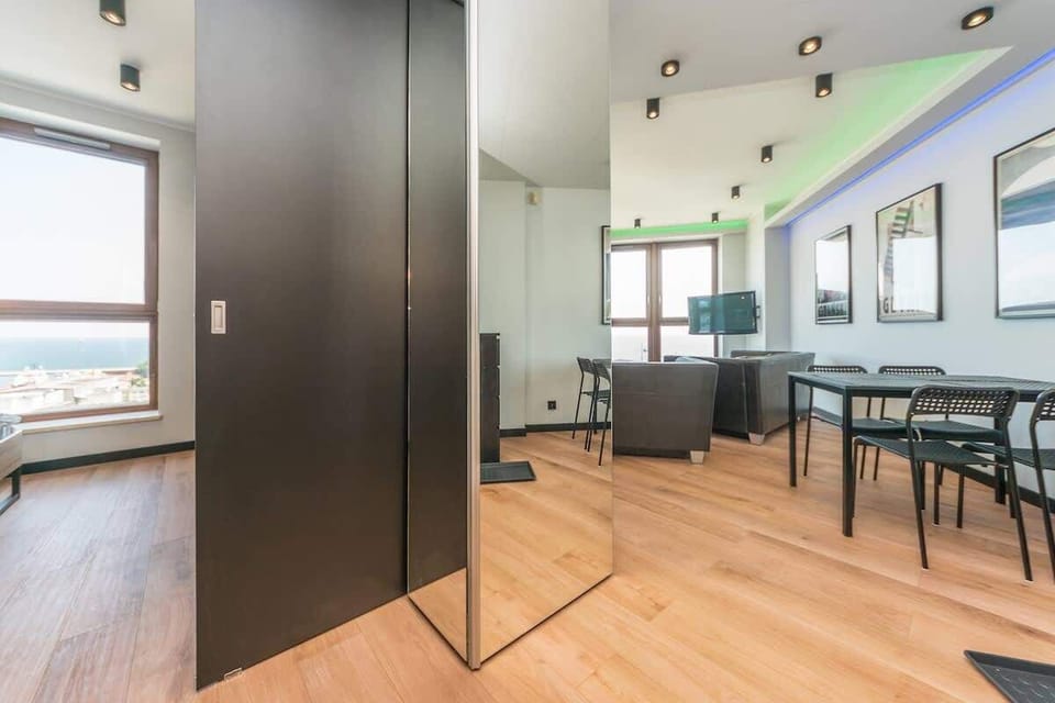 A stylish hallway with clean lines, practical storage, and a large mirror that enhances the sense of space.





