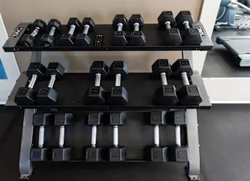 Modern gym with free weights and machines