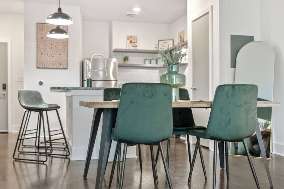 Chic dining area and modern kitchen with bar seating