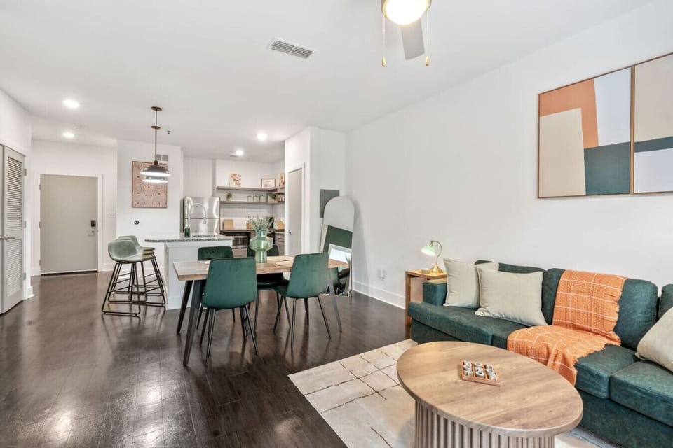 Open-concept living and dining space with stylish decor and Smart TV