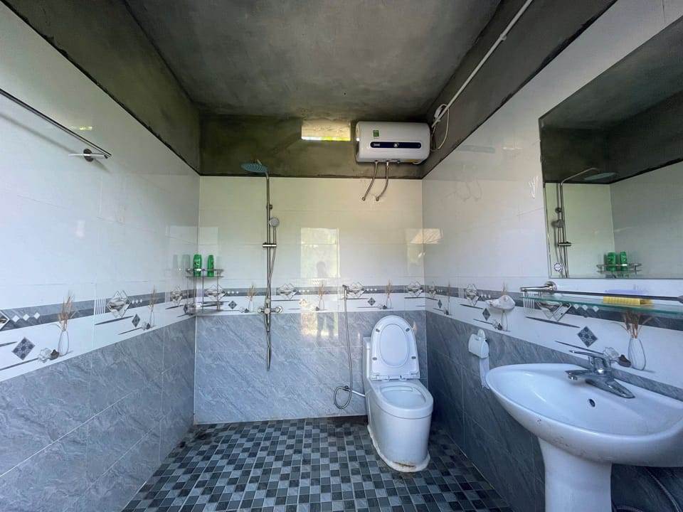 Shower, free toiletries, hair dryer, slippers