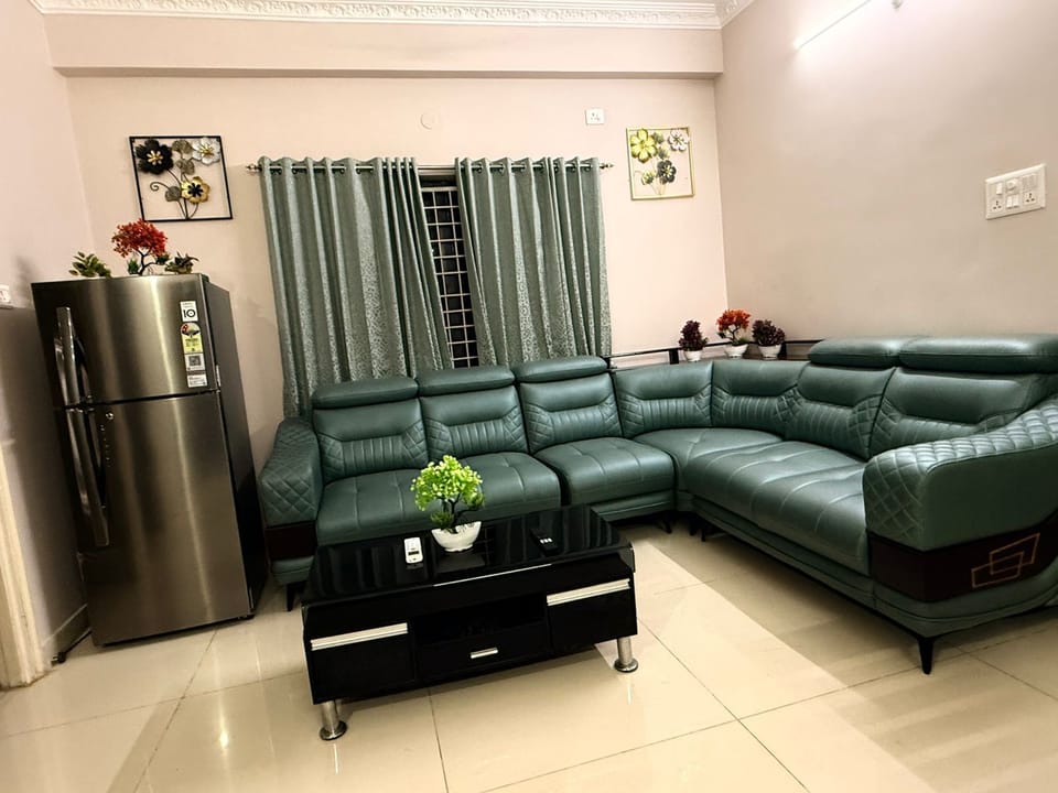 Premium Living Area: Sink into Luxury with a Stylish Sofa & Smart TV