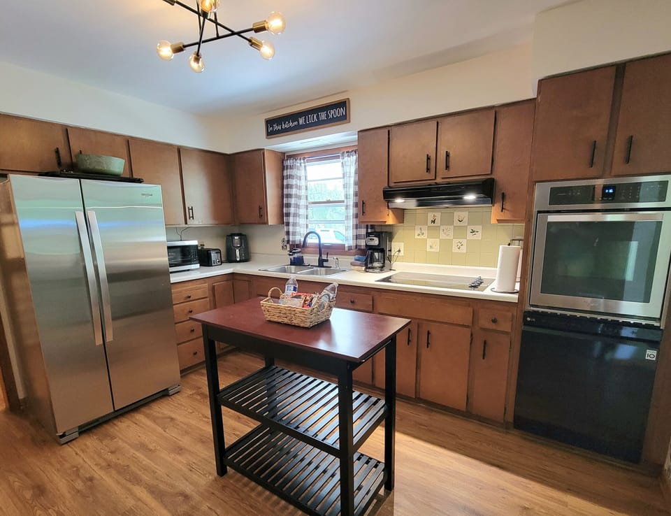 Kitchen: Fully stocked utensils and cookware. Microwave, drip coffee maker, air fryer, oven, stove, dishwasher, microwave